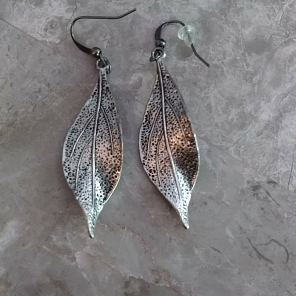 Stainless steel colored leaf earrings...3 Pairs 16.00...must buy 3 Pairs